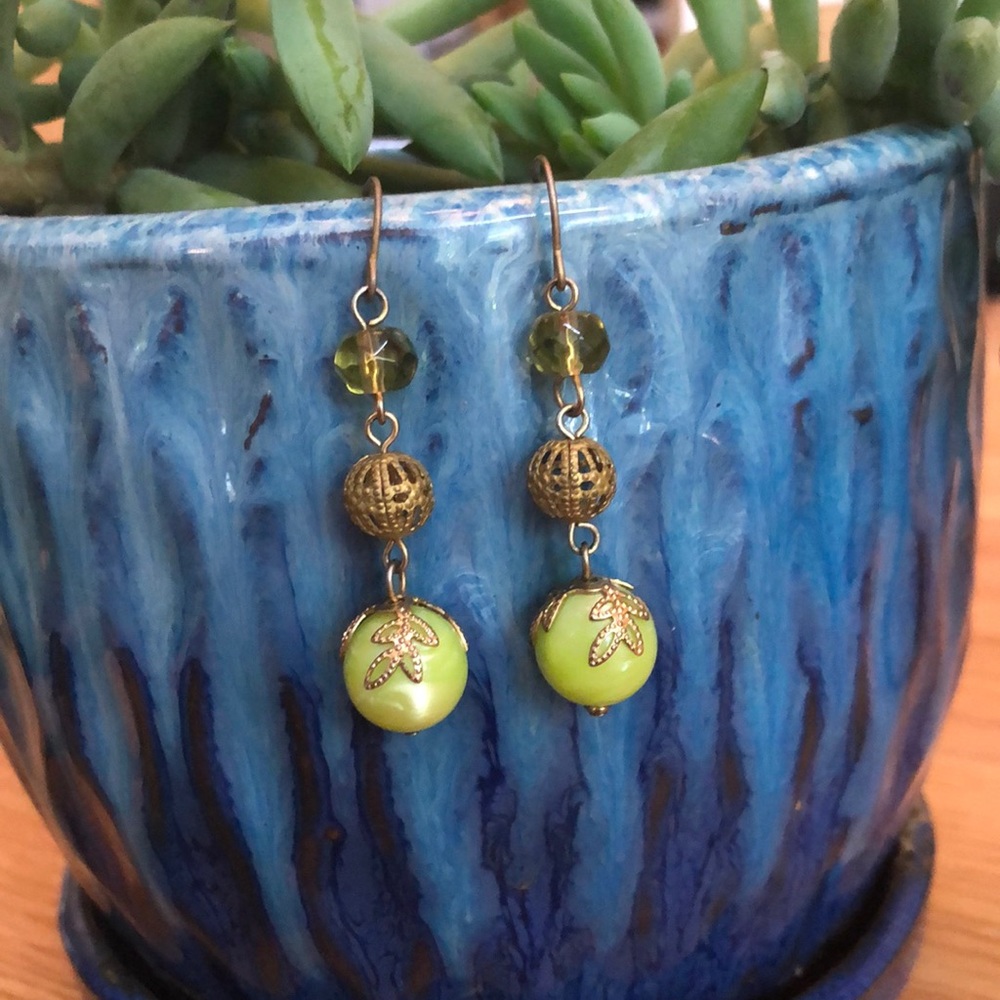 Green and gold dangle earrings